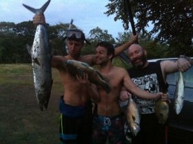 Three men holding up fish caught in Pedasi, Azuero Peninsula, Panama – Best Places In The World To Retire – International Living